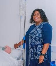 Sister (SR) Rutendo T. Zvidza, founder of PMT Health Care Institution, with a patient.